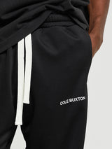 Cole Buxton - Contrast Tape Track Pants in Black and Green