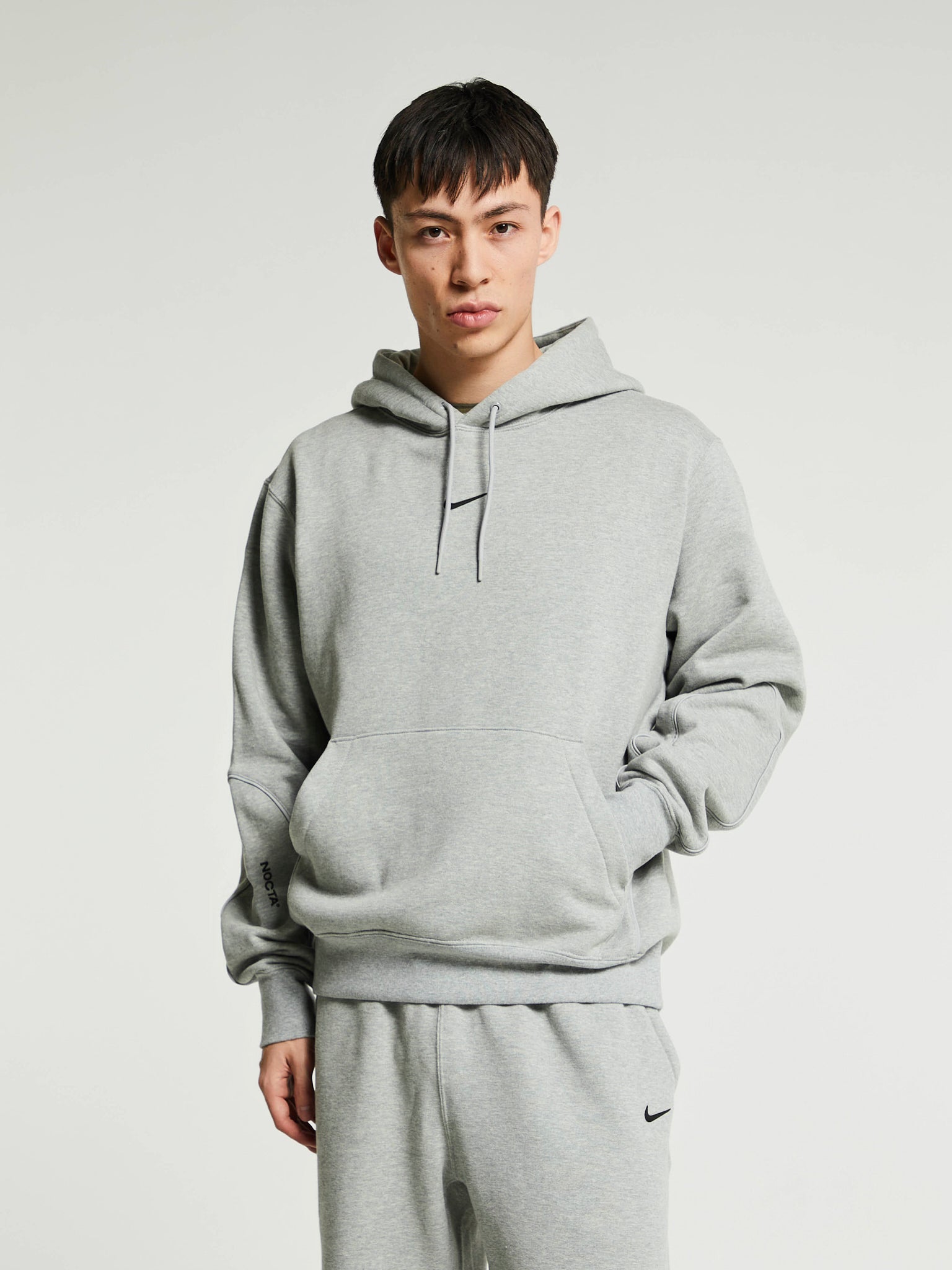 Nike - NOCTA Fleece Hoodie in Dark Heather Grey and Matte Silver