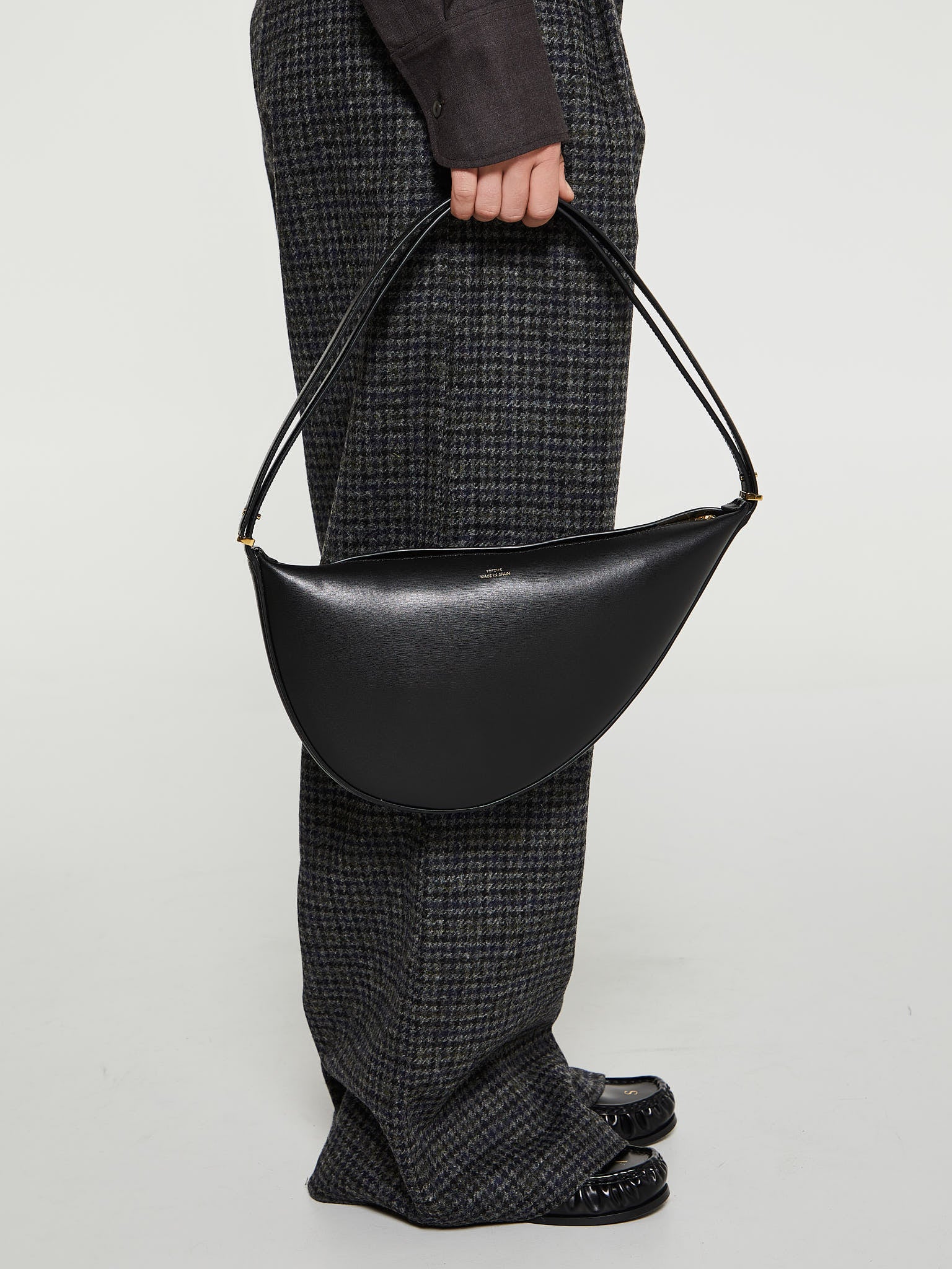 TOTEME - Leather Scooped Sling Bag in Black