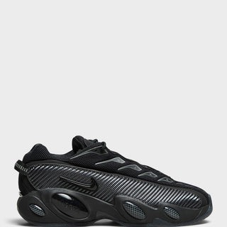 Nike - Nocta Glide Sneakers in Black, Black, Iron Grey and University Gold