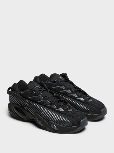 Nike - Nocta Glide Sneakers in Black, Black, Iron Grey and University Gold