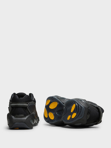 Nike - Nocta Glide Sneakers in Black, Black, Iron Grey and University Gold