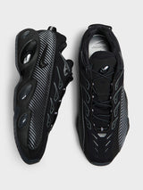Nike - Nocta Glide Sneakers in Black, Black, Iron Grey and University Gold