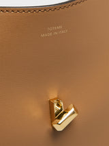TOTEME - T-Lock Leather Clutch in Camel