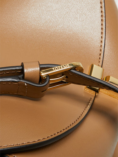 TOTEME - T-Lock Leather Clutch in Camel